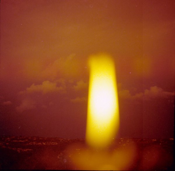 View through candle flame, Forestville, Dec 1977