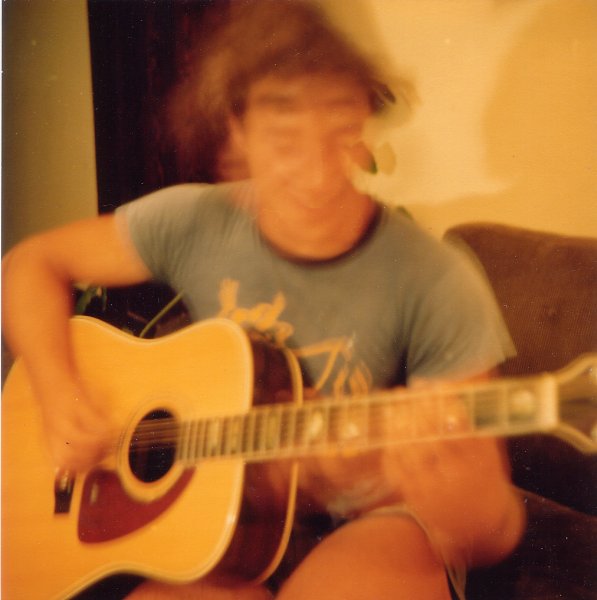 Man playing guitar, Cremorne, 19 Jan 1981